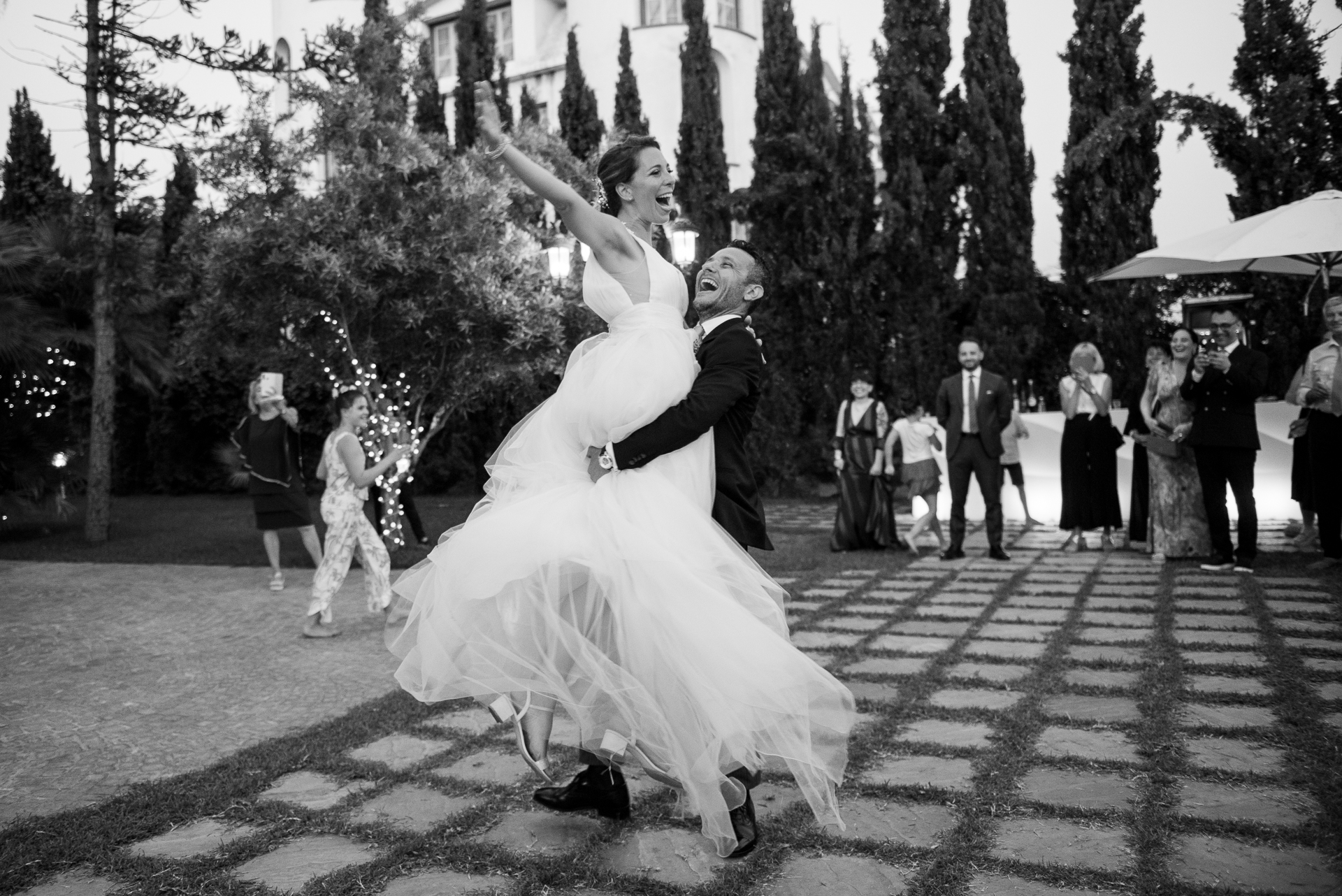 Documentary wedding photography in Calabria — bride and groom sharing an unposed, joyful moment